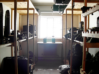 Image showing Military base, room and equipment for war, training or defense team on a mission for battle. Storage, army and guns or gear at warrior security bootcamp for government armed forces service warzone.