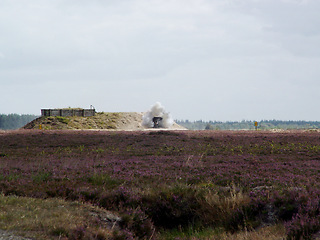 Image showing War, explosion and missile attack on a warzone during conflict or fighting for freedom with space. Sky, mockup and bomb with a cloud of smoke outdoor on a military battlefield in the countryside