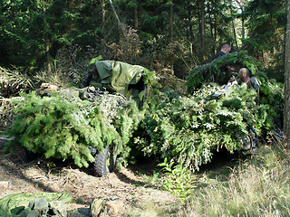 Image showing Forest, war and a military vehicle in camouflage for an attack or ambush during a special forces mission. Nature, army and a car covered in grass in the countryside for training as a soldier