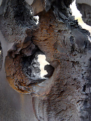 Image showing Wall, hole and damage of a concrete structure during war on a battlefield for military conflict. Construction, building and target shooting with exterior destruction of a surface in a warzone