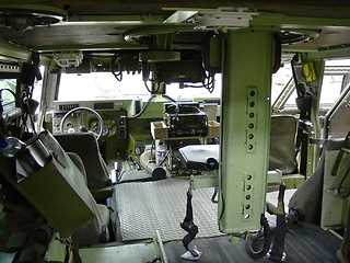 Image showing Military, army and interior of vehicle or transport for mission, training or battle with equipment or background. Transportation, van and inside for service, navigation or operation with armed forces