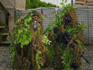 Image showing Gun, soldier camouflage and people aim, target or focus shooting at warrior, bootcamp academy challenge or Kosovo War. Military teamwork, sniper and army shooter scope battlefield arena with firearm