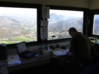 Image showing Radio tower, air traffic control and a man at his desk to monitor the airways with a view of the sky. Airport, aviation and navigation with a person working on flight strategy or direction of travel