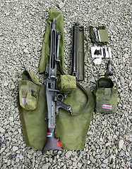 Image showing Military, weapon and gun with cleaning kit on ground outdoor for service, mission or protection of soldier. Rifle, sniper or pistol for maintenance, danger or shooting on battlefield or operation