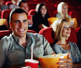 Image showing Cinema, portrait and happy couple with popcorn, watching film and romantic date together. Movie night, man and woman in theater show with snacks, drink and smile in auditorium to relax in audience.