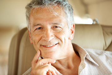 Image showing Senior man in plane, travel and transportation with flying, portrait and vacation with international journey. Private airplane, luxury transport and retirement holiday, happy traveller with flight