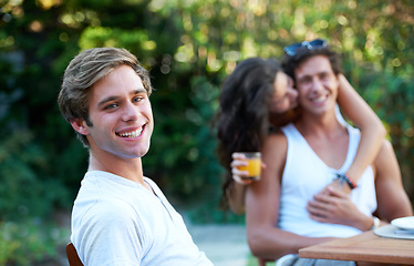 Image showing Man, portrait and friends in a backyard at home with bbq and happy event by a table. Group, teenager and young people together in a summer in a garden with a smile and food for lunch outdoor