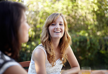 Image showing Happy, woman and friends outdoor in backyard with conversation and communication at home. Summer, laughing and funny joke with young people smile together in a garden with talking ready for bbq