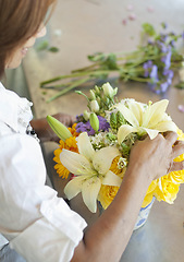 Image showing Flowers, florist and hands of small business owner doing floral product, quality check or bouquet in a store or shop. Arrangement, plant and person or entrepreneur for sustainable market service