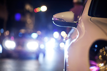 Image showing Car, traffic and road at night with bokeh for transportation, asphalt and lights in an urban town. City street, taxi and travel or driving in glow for journey, commute or moving on the highway