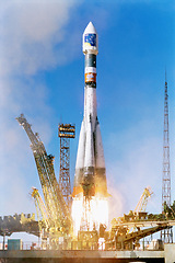 Image showing Rocket launch into sky, travel and space mission for research, exploration and discovery in cosmos. Science, aerospace innovation or technology, spaceship in flight at ground site with flame and fuel