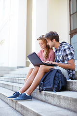 Image showing University, education and students with laptop on building steps for team project research. Learning, studying and gen z friends online on stairs with book for assignment, exam or homework discussion