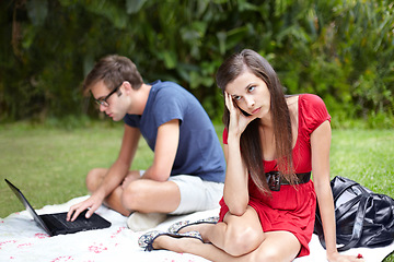 Image showing Couple, conflict and frustrated woman on disaster picnic date with distracted man on laptop in forest. Crisis, fail and annoyed female with workaholic male in park online with social media addiction