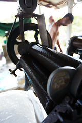 Image showing Rubber, closeup and industrial roller machine in workshop, factory and production warehouse. Manufacturing, agriculture and equipment for rolling latex, plastic and natural material on plantation