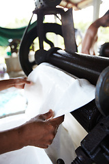 Image showing Rubber, industry and hands of person with roller in workshop, factory and outdoor warehouse. Manufacturing, production and person with machine for rolling latex, plastic and material plantation