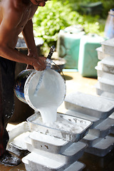 Image showing Rubber, farming and person with container in workshop, factory and production warehouse. Plantation, agriculture and worker with bucket for labour, plastic and material manufacturing in Thailand