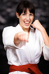 Image showing Woman, karate and punch in portrait, fight and self defense sport with muay thai and training. Athlete, combat and power with fitness, martial arts and energy with warrior, exercise and taekwondo