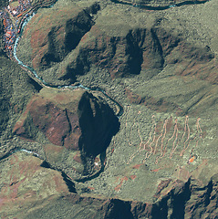 Image showing Location, aerial landscape and Earth with satellite image, mountain and valley, city or village. Nature, background and view from above with map and topography, country and geography with aerospace