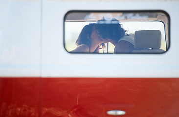 Image showing Caravan, transportation and couple kiss on road trip, travel and vacation with people in relationship and commitment. Love, intimacy with window and freedom on adventure together, transport and date