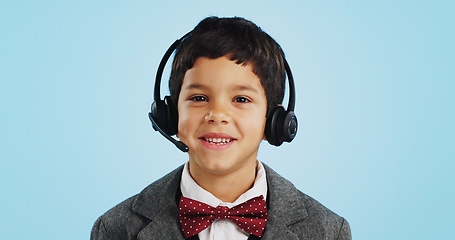 Image showing Face, studio or child consultant in call center talking or networking for telecom on blue background. Young, contact or friendly kid sales agent in communication or conversation at customer service