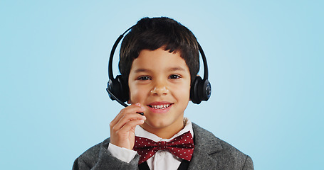 Image showing Face, studio or child consultant in call center talking or networking for telecom on blue background. Young, contact or friendly kid sales agent in communication or conversation at customer service