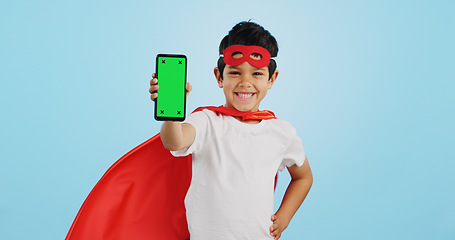 Image showing Child, game and portrait with phone green screen for superhero, justice or happy mockup with ux tracking markers. Kid, super hero and smartphone with mock up space and vigilante, costume and games