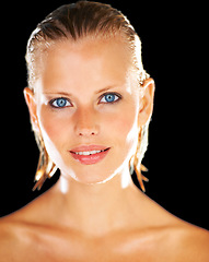 Image showing Skincare, shower and portrait of woman on black background for wellness, grooming and satisfaction. Water, luxury spa and face of person with wet hair for beauty, washing and cleaning in studio