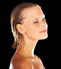 Image showing Shower, beauty and face of woman on black background for wellness, grooming and cosmetics. Satisfaction, luxury spa and happy person with eyes closed for skincare, washing and cleaning in studio