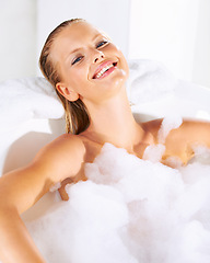 Image showing Happy, woman and bath portrait with cleaning, skincare and shampoo treatment with smile. Wellness, bubble and smile of a female person with soap in a bathroom for hair wash and relax with foam