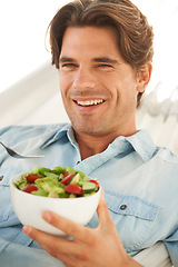 Image showing Portrait, man and smile while eating salad for detox, clean diet and to lose weight at home. Happy guy with bowl of healthy food, nutrition and vegan benefits for digestion, wellness and lunch meal