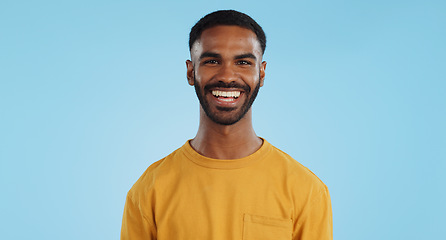 Image showing Happiness, man and laughter with comedy in studio, casual fashion and portrait by blue background. Mexican person, face and positive attitude with reaction to silly joke, mockup and announcement