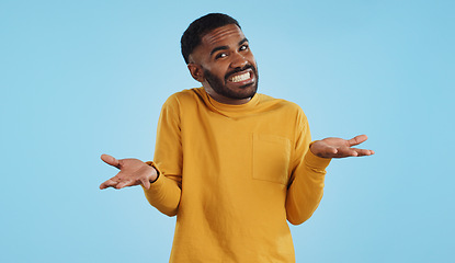 Image showing Confused, hands and face of man in studio with dont know, gesture or ask on blue background. Why, portrait and guy model with oops, mistake or doubt, unsure or forget, guess or palm scale questions
