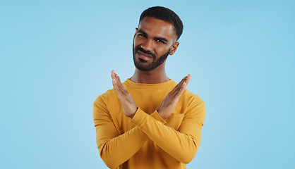 Image showing Shaking head, no and face of a man with stop, rejection and disappointment on a studio background. Sad, angry and portrait of a person with a gesture for a protest, disapproval or refusal with mockup