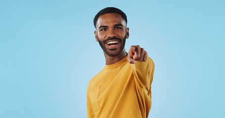 Image showing Face and man with hand pointing at you in studio with choice, selection or offer on blue background. Opportunity, offer and portrait of male model with emoji for join us, deal or invitation