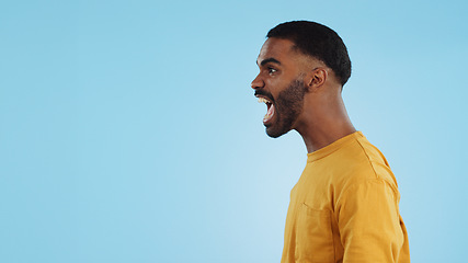 Image showing Stress, angry and man shouting in studio with anxiety, frustrated or disaster on blue background. Mistake, fail and profile of guy model with screaming reaction to mental health crisis, fear or panic