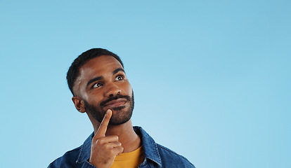 Image showing Man, thinking and planning idea with decision and choice in studio on blue background and questions. Brainstorming, person and problem solving ideas or why with solution and remember on mock up space