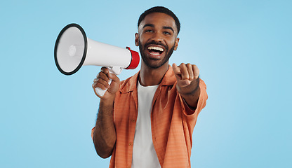 Image showing Young man, megaphone and announcement, choice or broadcast for winner, join us or winning opportunity in studio. Face of african person with voice, pointing you and competition on a blue background