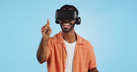 Image showing Man, virtual reality and glasses in studio with hand, click and swipe with smile for metaverse by blue background. Person, AR vision and futuristic game with 3D user experience, cyber ui and esports