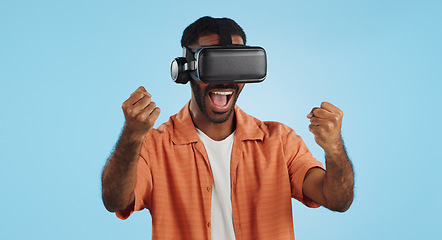 Image showing Gamer man, virtual reality and glasses in studio with hand, click and swipe in metaverse by blue background. Person, AR vision and futuristic 3D user experience with grab, cyber ui and digital world