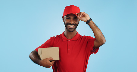 Image showing Happy man, box and delivery in transport service, package or order in studio against a blue background. Portrait of male person or courier guy smile with parcel, cargo or logistics on mockup space