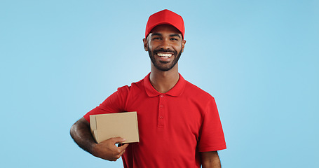 Image showing Happy man, box and delivery in transport service, package or order in studio against a blue background. Portrait of male person or courier guy smile with parcel, cargo or logistics on mockup space