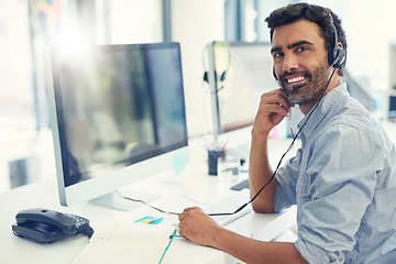 Image showing Portrait, telemarketing and man with a computer, customer service and lens flare with headphones, crm and tech support. Face, office or agent with a headset, call center and help desk with consultant