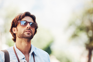 Image showing Travel, man or tourist on holiday, vacation or weekend trip for a fun adventure in Italy with sunglasses. Bokeh mockup space, view or person with fashion or freedom sightseeing in nature journey