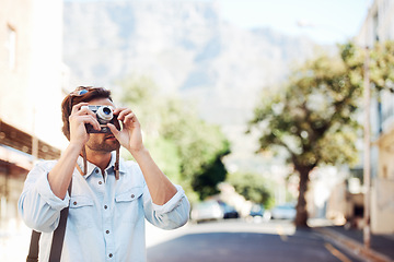 Image showing Photographer, camera or tourist on holiday, vacation or trip for a fun adventure in Italy on road. Outdoor, picture or man with freedom sightseeing on journey or urban street for travel in summer