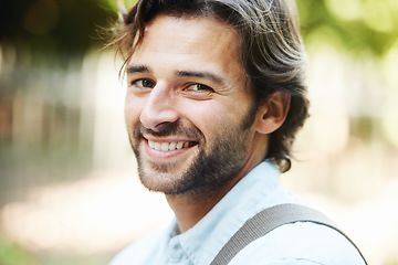 Image showing Portrait, smile or happy man in park for travel in summer for holiday vacation or break in garden. Confident tourist, wellness or face of person in nature resting in a natural environment to relax