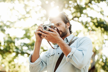 Image showing Picture, photographer or man in park on holiday vacation trip for creativity, shooting or tourism memory. Photography, travel or male tourist with camera for sightseeing or trees in nature in summer