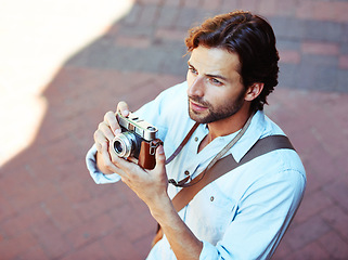 Image showing Camera, photographer or tourist in city to travel on holiday vacation trip for creativity or tourism adventure. Photography, thinking or man with pictures for sightseeing in urban town from above