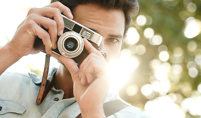 Image showing Camera, photography or face of man in park on holiday vacation trip for creativity, shooting or tourism memory. Photographer, travel or male tourist with pictures for sightseeing in nature in summer