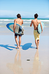 Image showing Running, surfing and rear view of men friends at a beach with freedom, energy or fun. Back, fitness and surfer people at the ocean excited for summer vacation, workout or water sports hobby in Hawaii