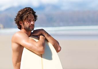 Image showing Surfing, fitness and man thinking at a beach with surfboard for training, freedom or fun. Relax, adventure and male surfer at the sea for water sports, travel or vacation, holiday or summer hobby